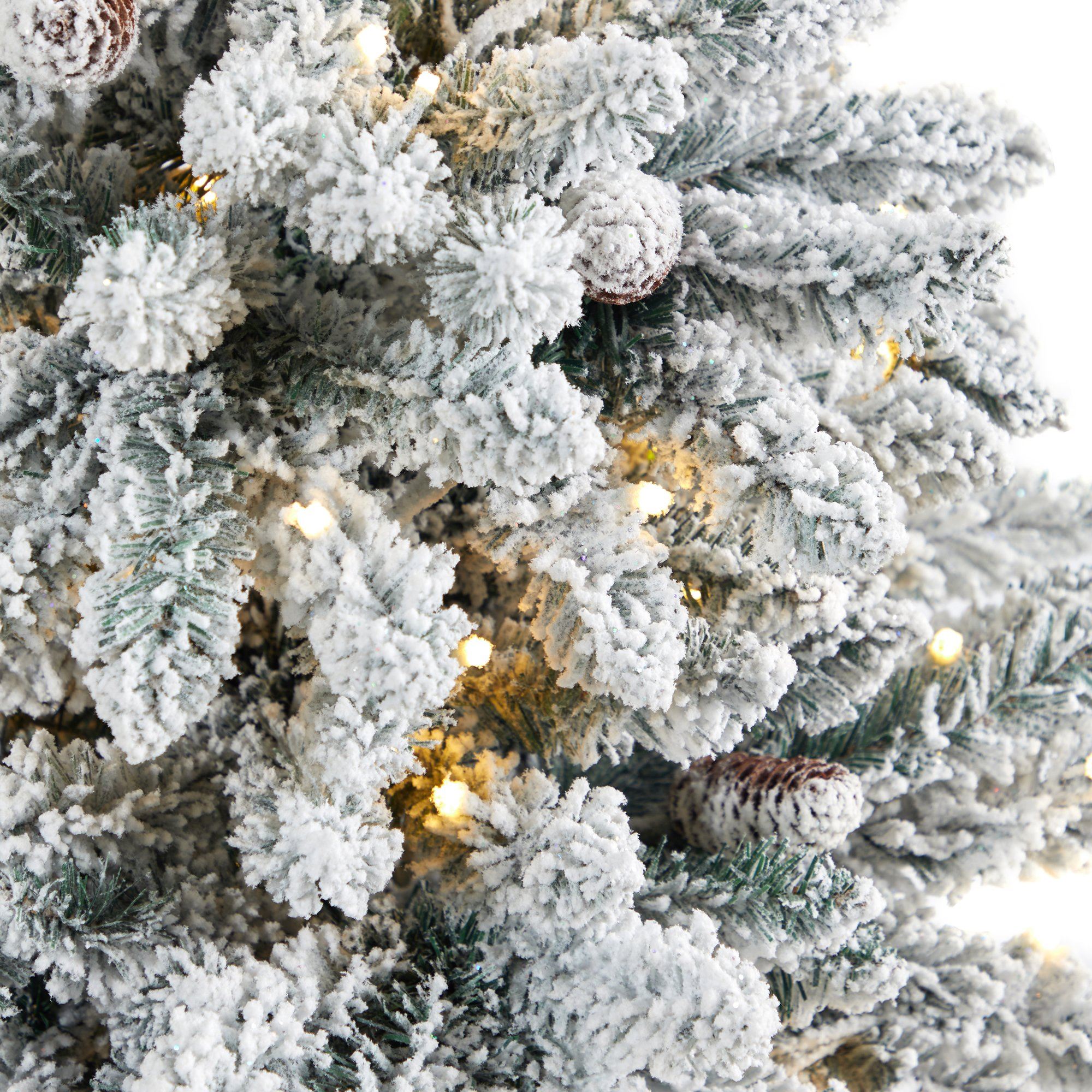 4.5’ Flocked Livingston Fir Artificial Christmas Tree with Pine Cones and 150 Clear Warm LED Lights in Tall White Planter